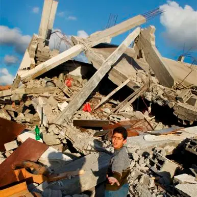 Gazans dig bodies from the rubble as ceasefire begins