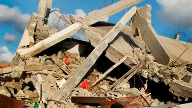 Gazans dig bodies from the rubble as ceasefire begins