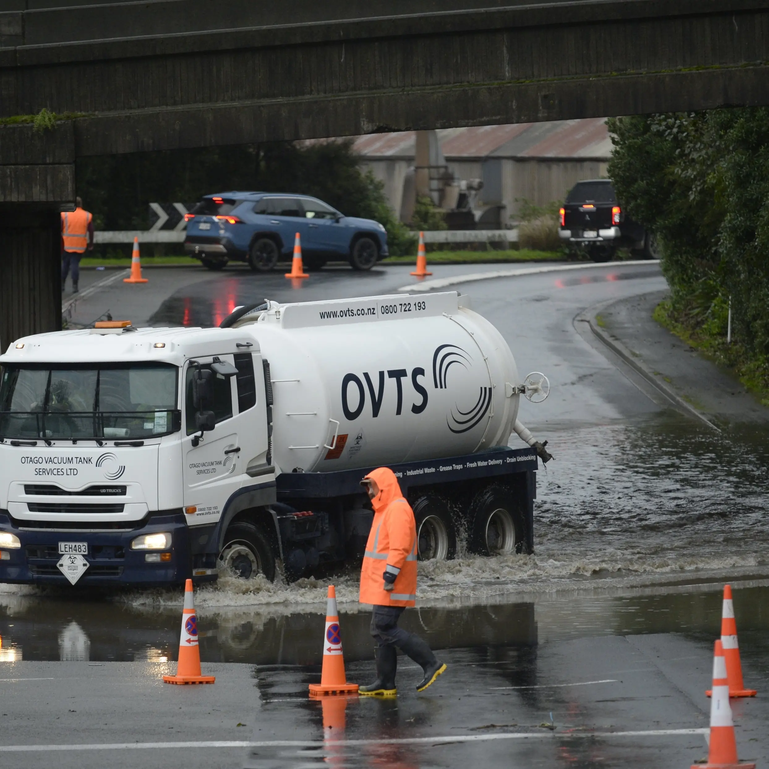 Road reopens after driver rescued from flooding