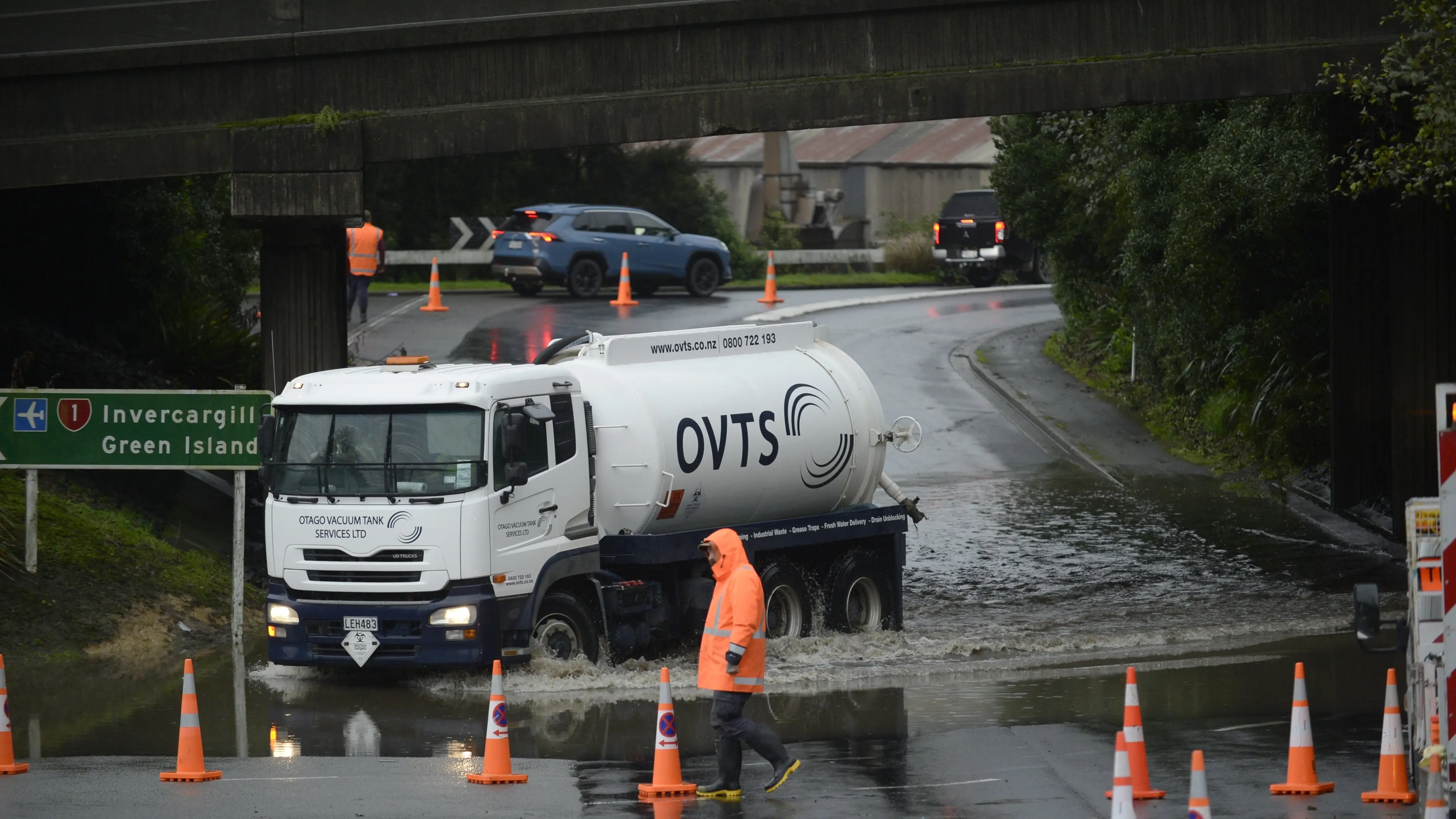 Road reopens after driver rescued from flooding