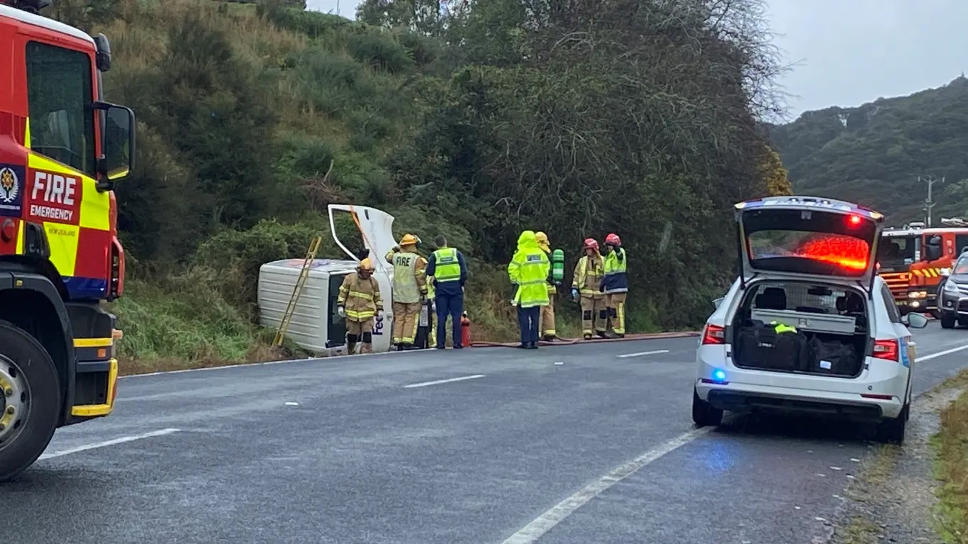 One injured after delivery van rolls off road