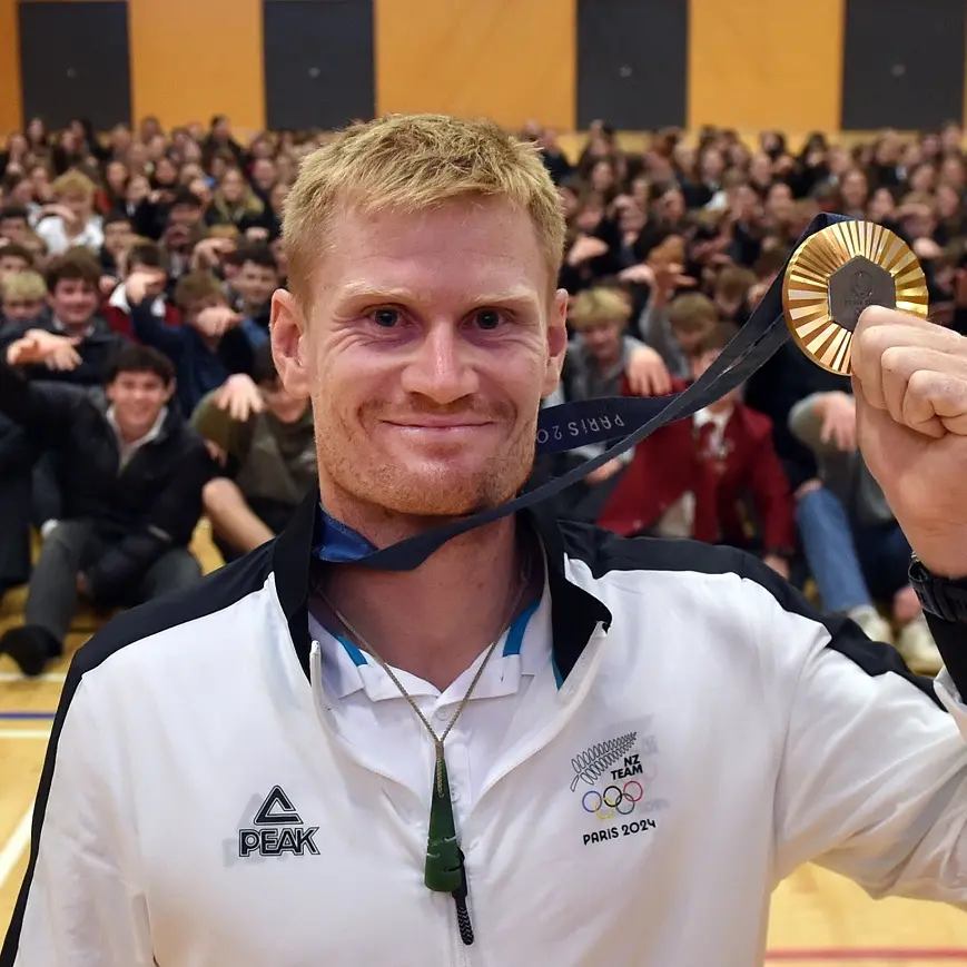 Alex’s golden boy receives hero’s welcome