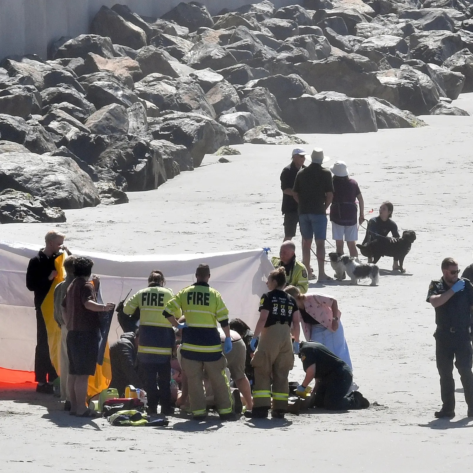 Surfer deeply upset as bid to save man fails