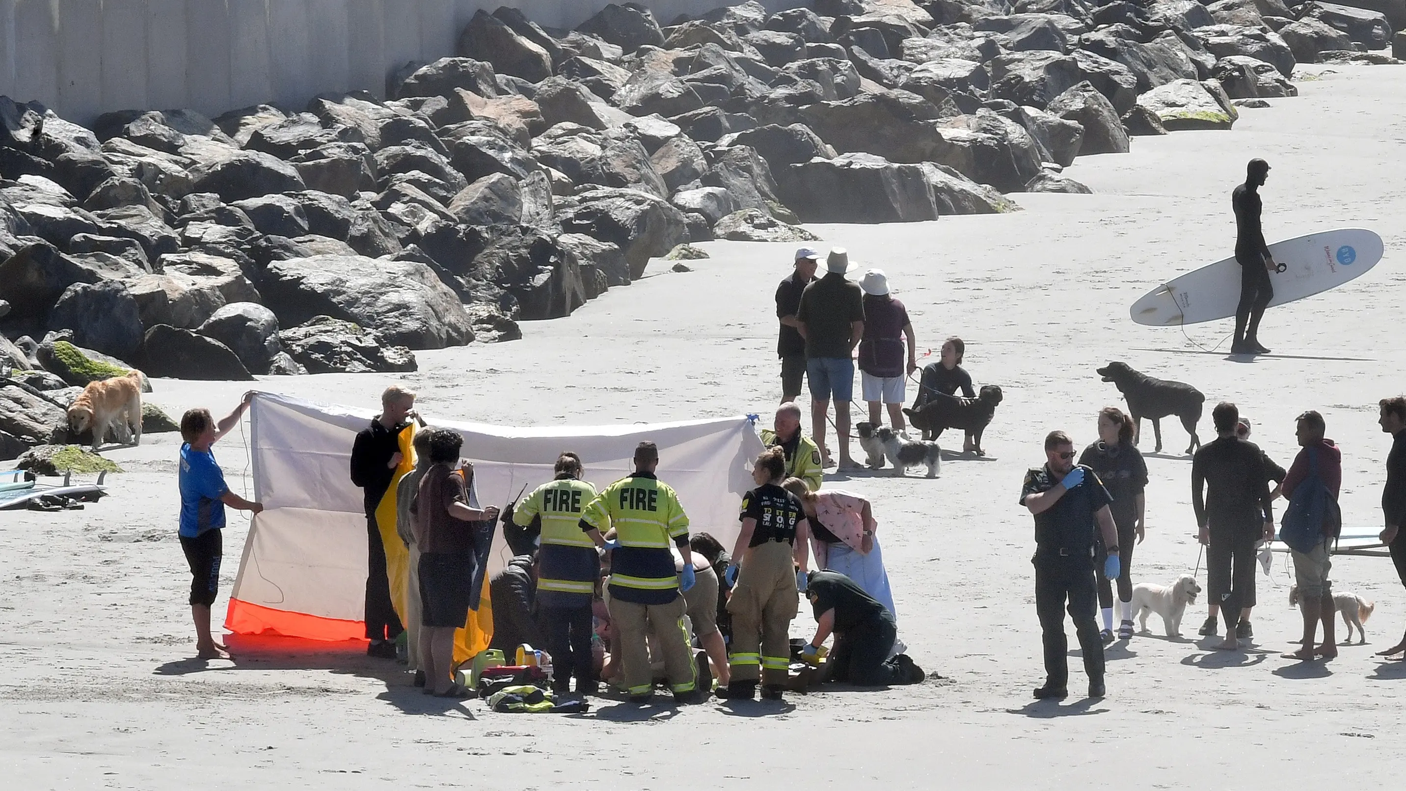 Surfer deeply upset as bid to save man fails