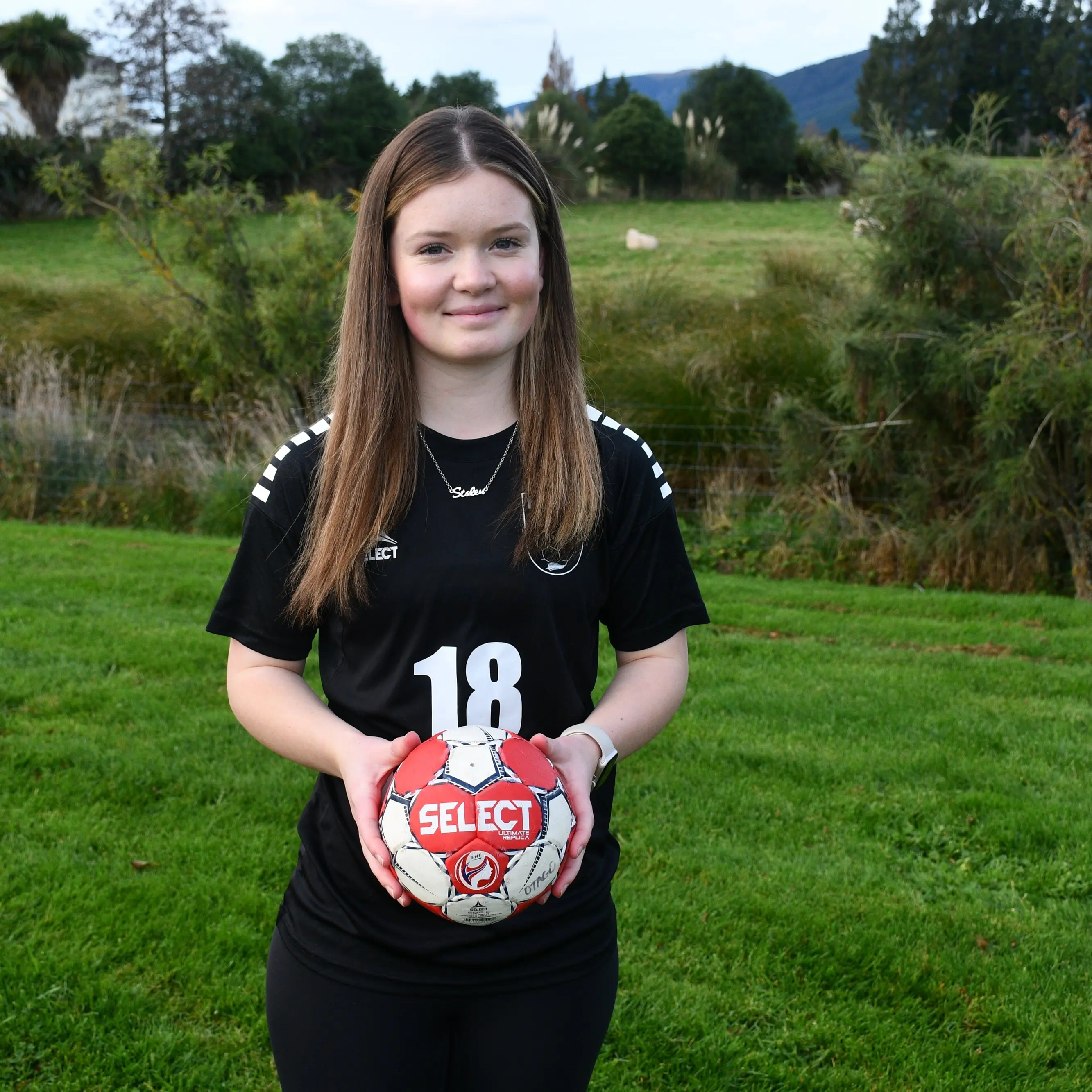 Sporting teenager having a ball