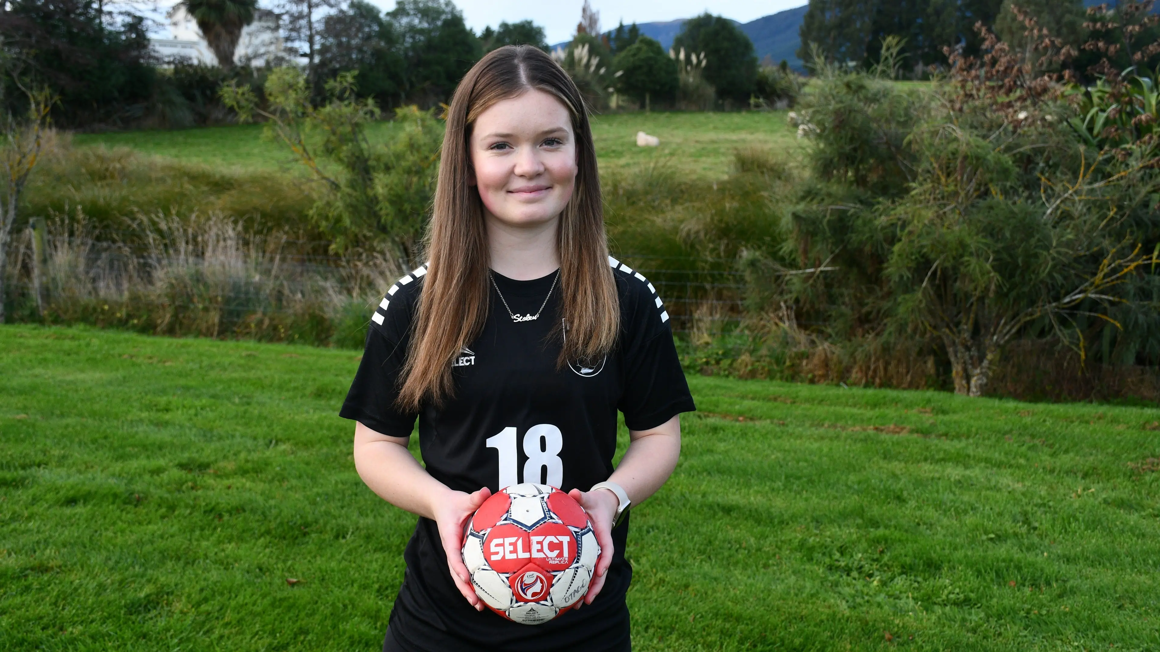 Sporting teenager having a ball