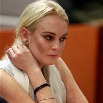 Lohan cuffed after court appearance