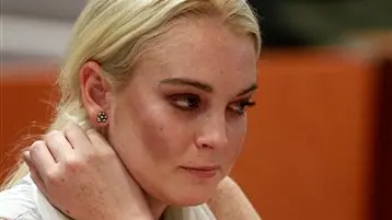 Lohan cuffed after court appearance