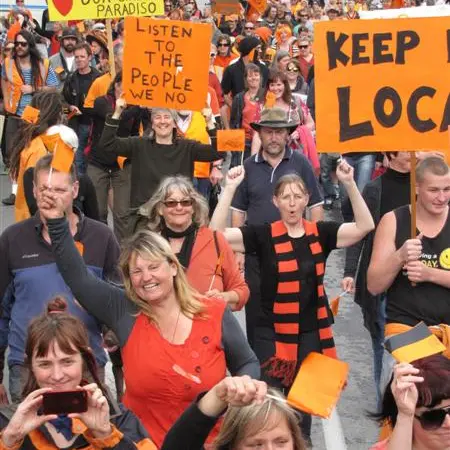 Crowd marches for Wastebusters