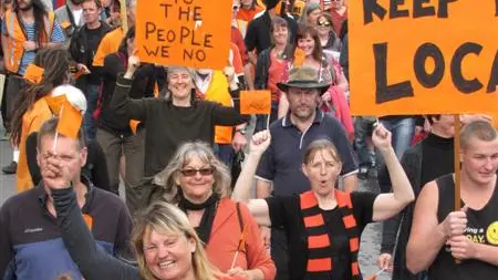 Crowd marches for Wastebusters