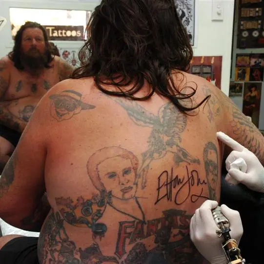 Super-fan gets Elton's autograph tattooed on his back