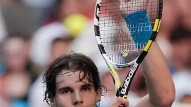 Tennis: Nadal overcomes injury to advance in Melbourne