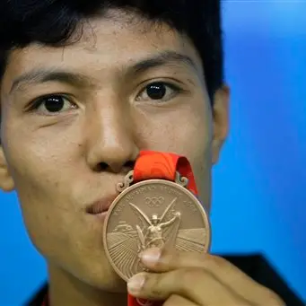 Afghan medallist wins bronze - and a house