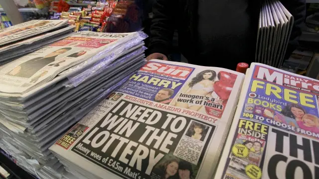 Police arrest 5 at Murdoch's Sun newspaper