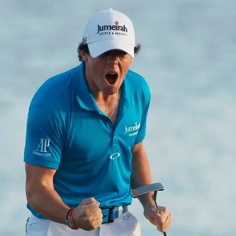 Golf: McIlroy holds off Woods charge to take top spot