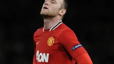 Football: Rooney apologises for breaking fan's wrist