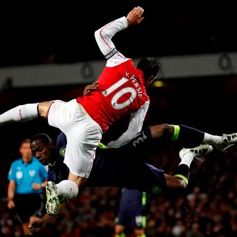 Football: Battling Wigan stun Arsenal