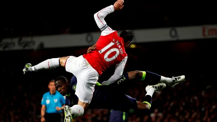 Football: Battling Wigan stun Arsenal