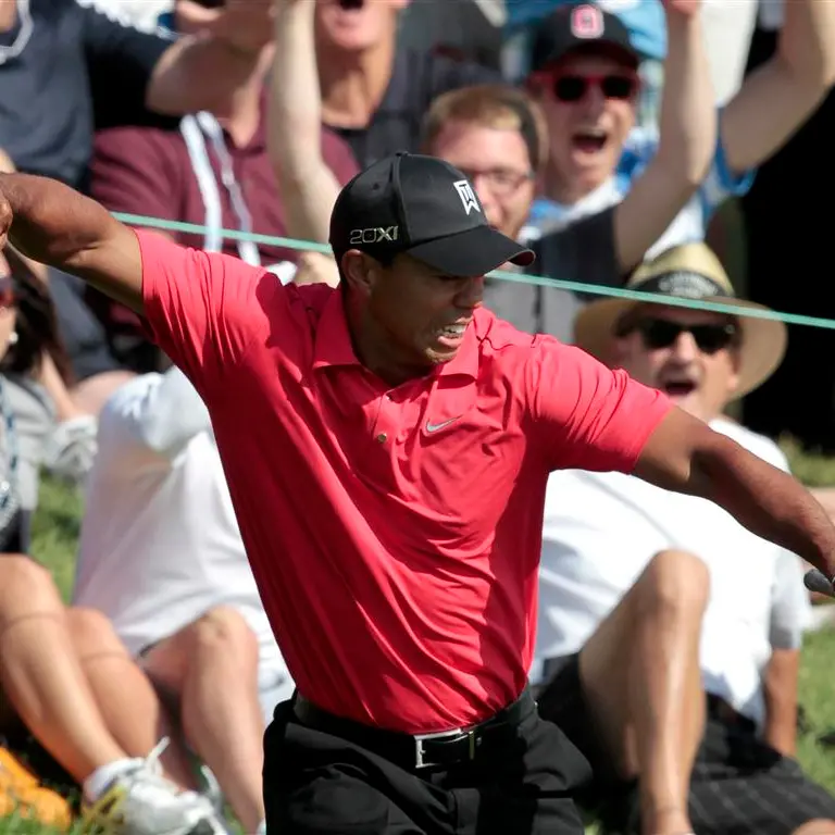 Golf: Stunning finish earns Woods victory
