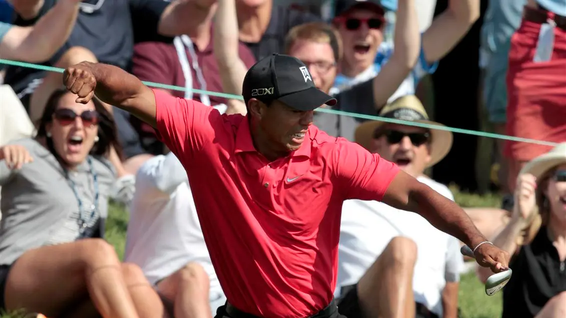 Golf: Stunning finish earns Woods victory