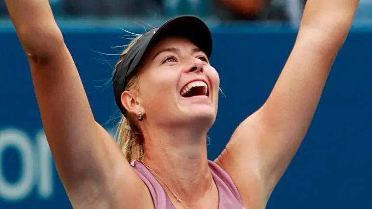 Tennis: Sharapova claws way into semis