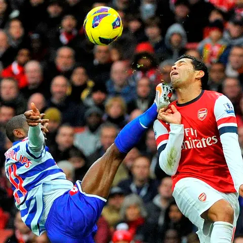Football: Arsenal strike late to beat QPR