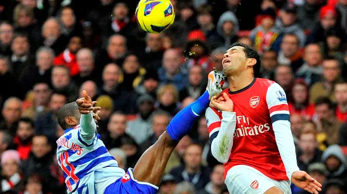 Football: Arsenal strike late to beat QPR