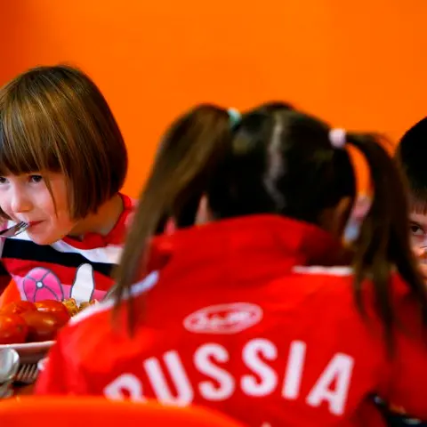 Putin signs anti-US adoption bill