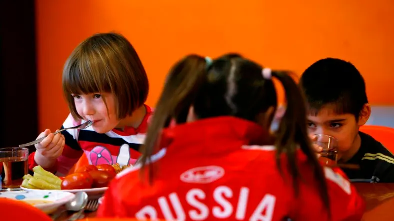 Putin signs anti-US adoption bill