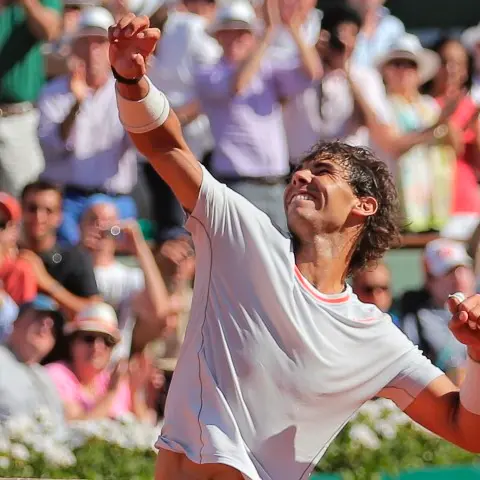 Tennis: Nadal edges Djokovic to reach final