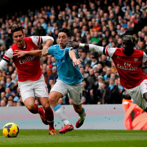 Football: Man City sink Arsenal in goalfest
