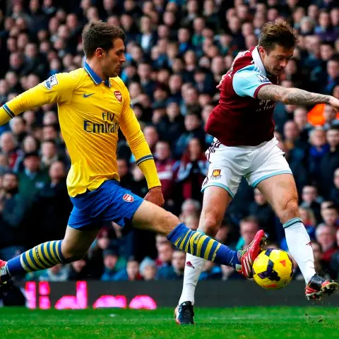 Football: Walcott double puts Arsenal back on top