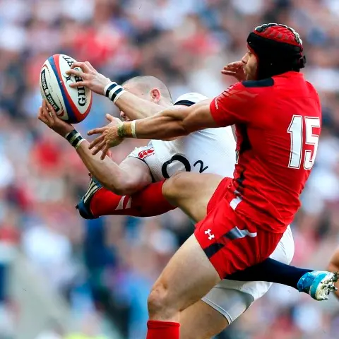 Rugby: England down Wales to stay in title hunt