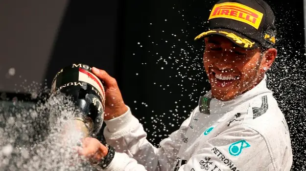 Motorsport: Hamilton triumphs in home GP