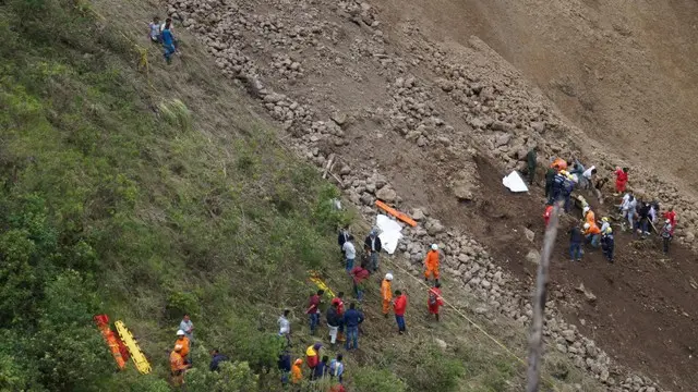 Several dead after landslide pushes bus into ravine