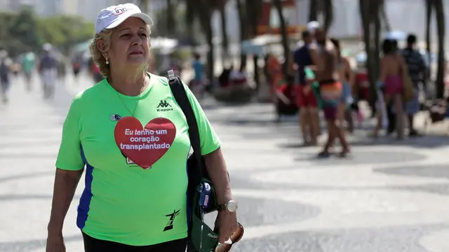 Woman gets Olympian's heart, vows to be active
