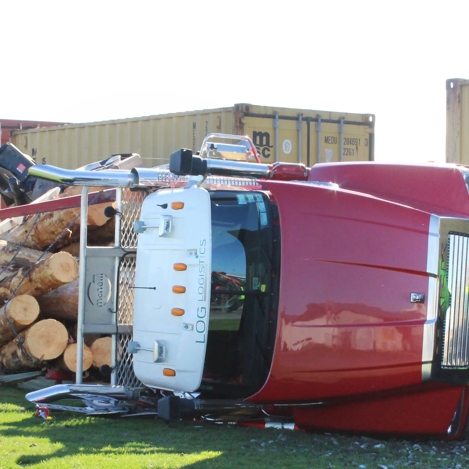 Train and logging truck collide
