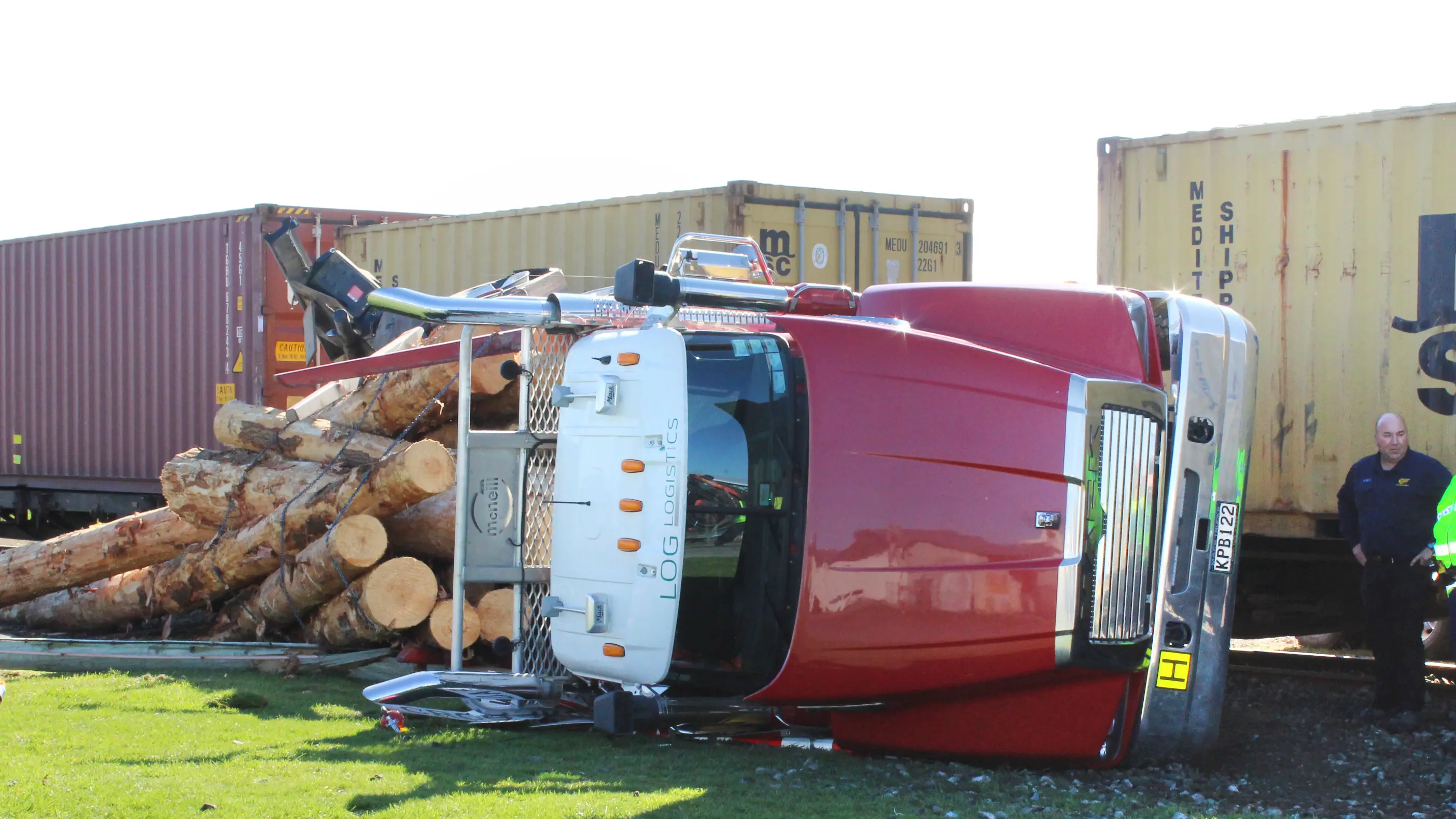 Train and logging truck collide
