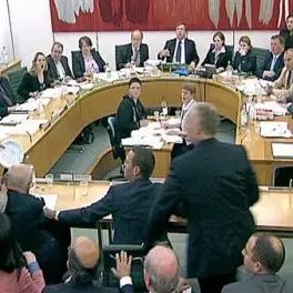 Protester attacks Murdoch during dramatic hearing