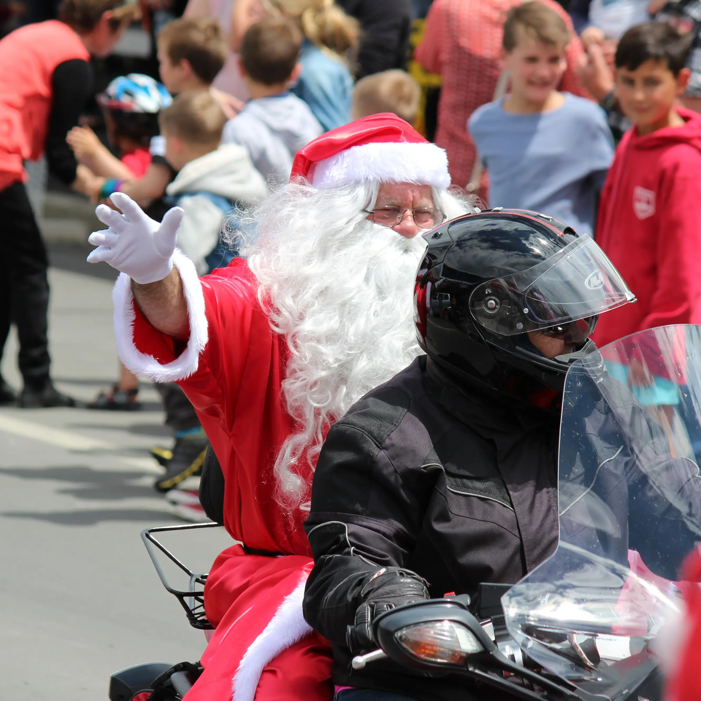 Big man in red steals show from back of bike