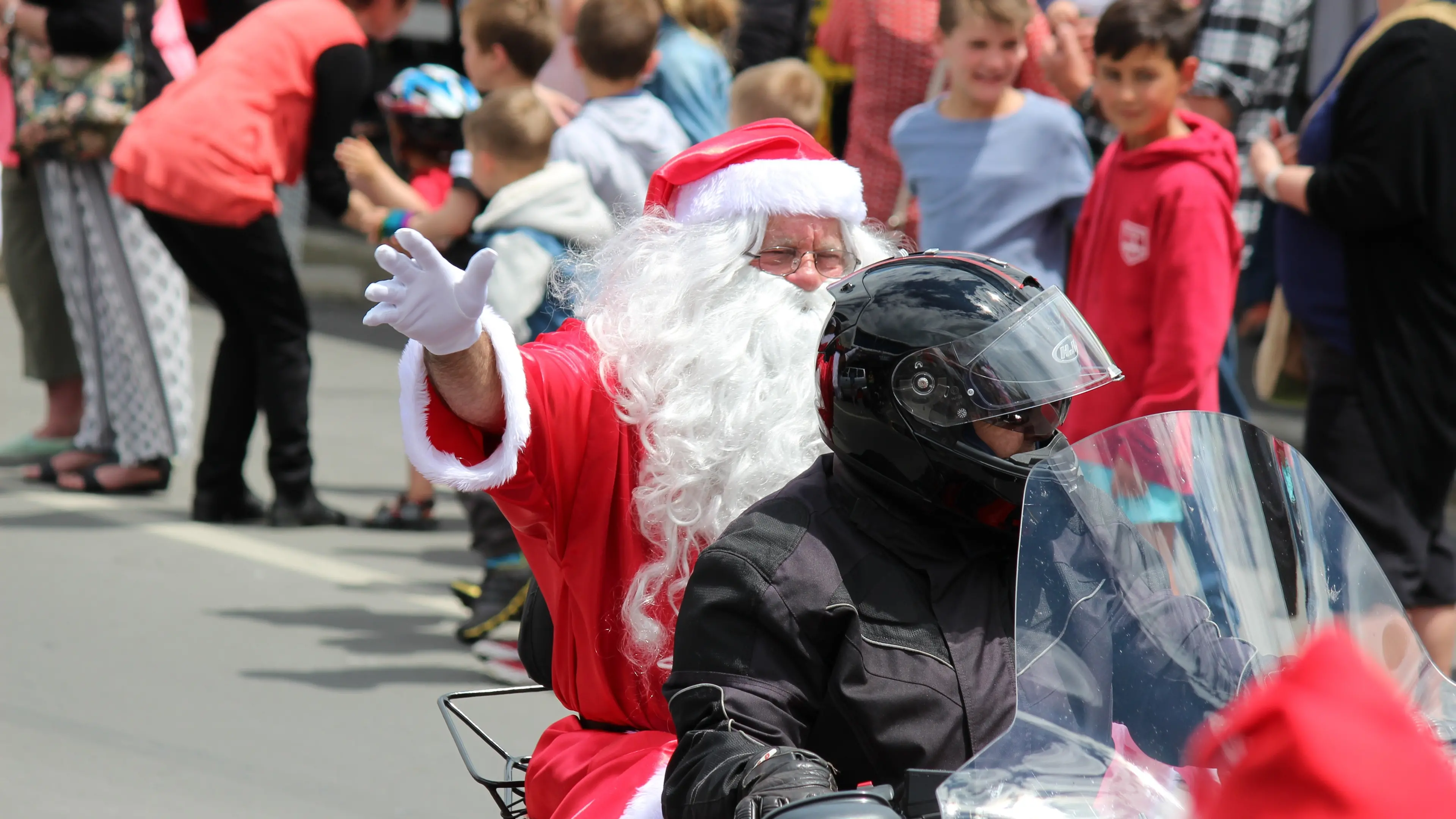 Big man in red steals show from back of bike