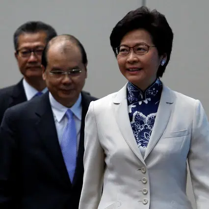 Hong Kong's first female leader promises caring rule