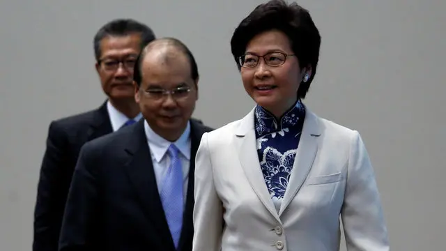 Hong Kong's first female leader promises caring rule