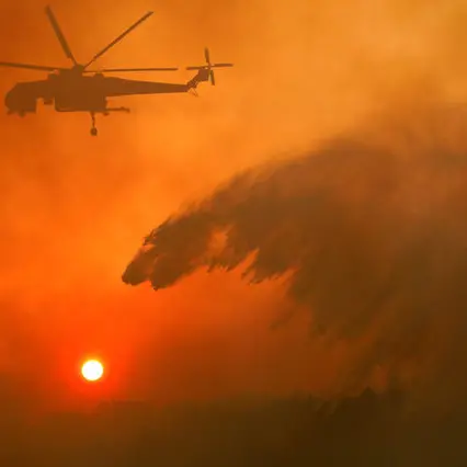 Firefighters battle wildfires across Greece