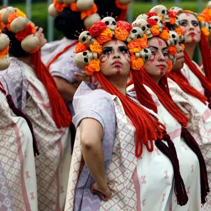 After quakes, Day of the Dead parade honours heroes