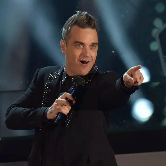 Robbie Williams selling soul for World Cup gig - critic