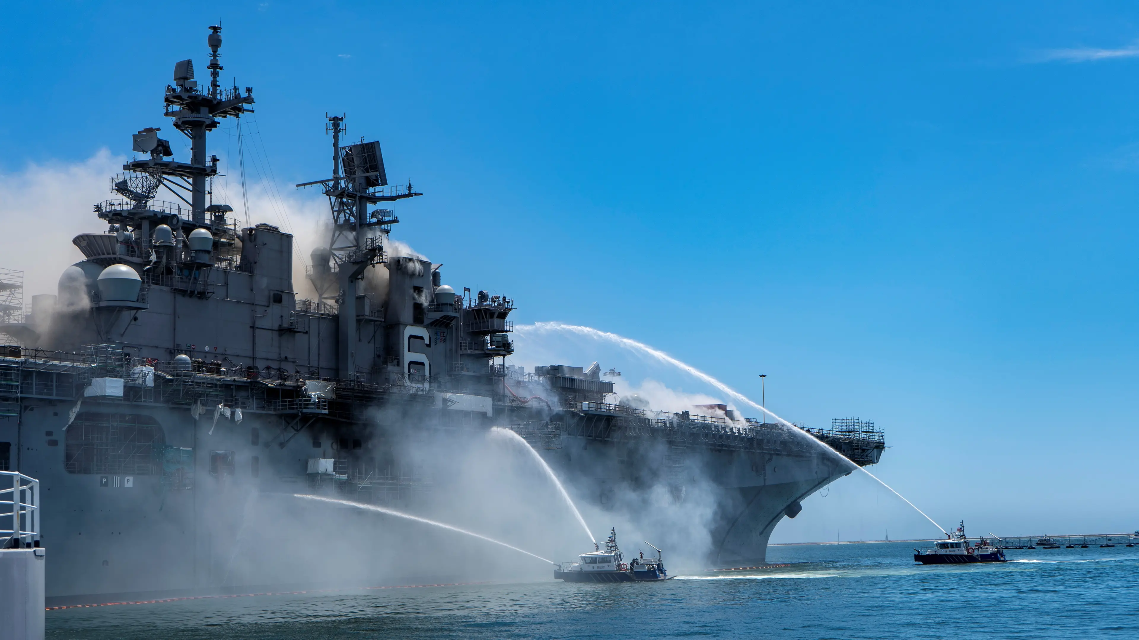US Navy battles for second day to save burning warship