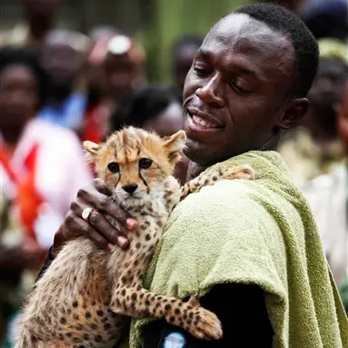 World's fastest man adopts world's fastest feline