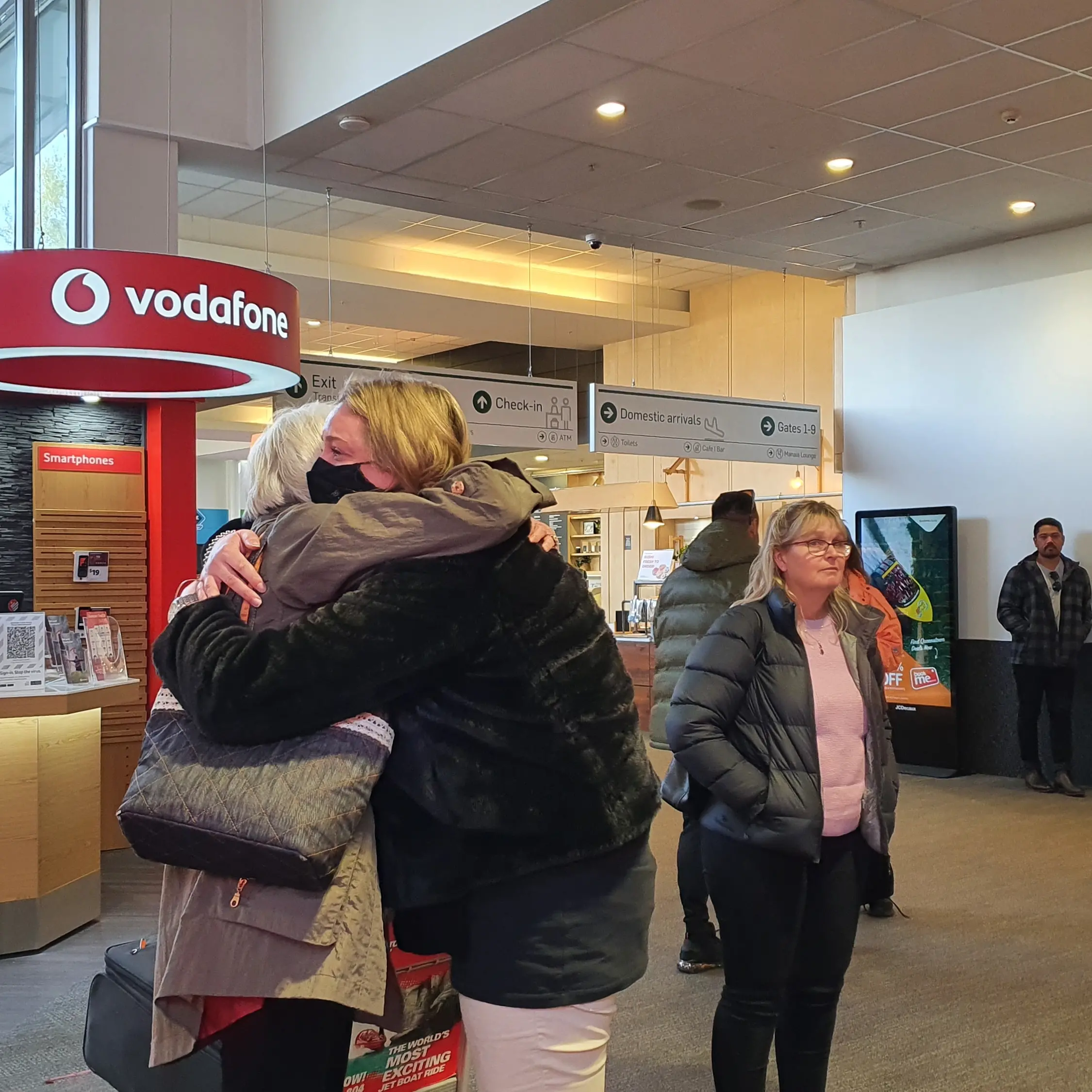 Loved-ones embrace as travel bubble resumes