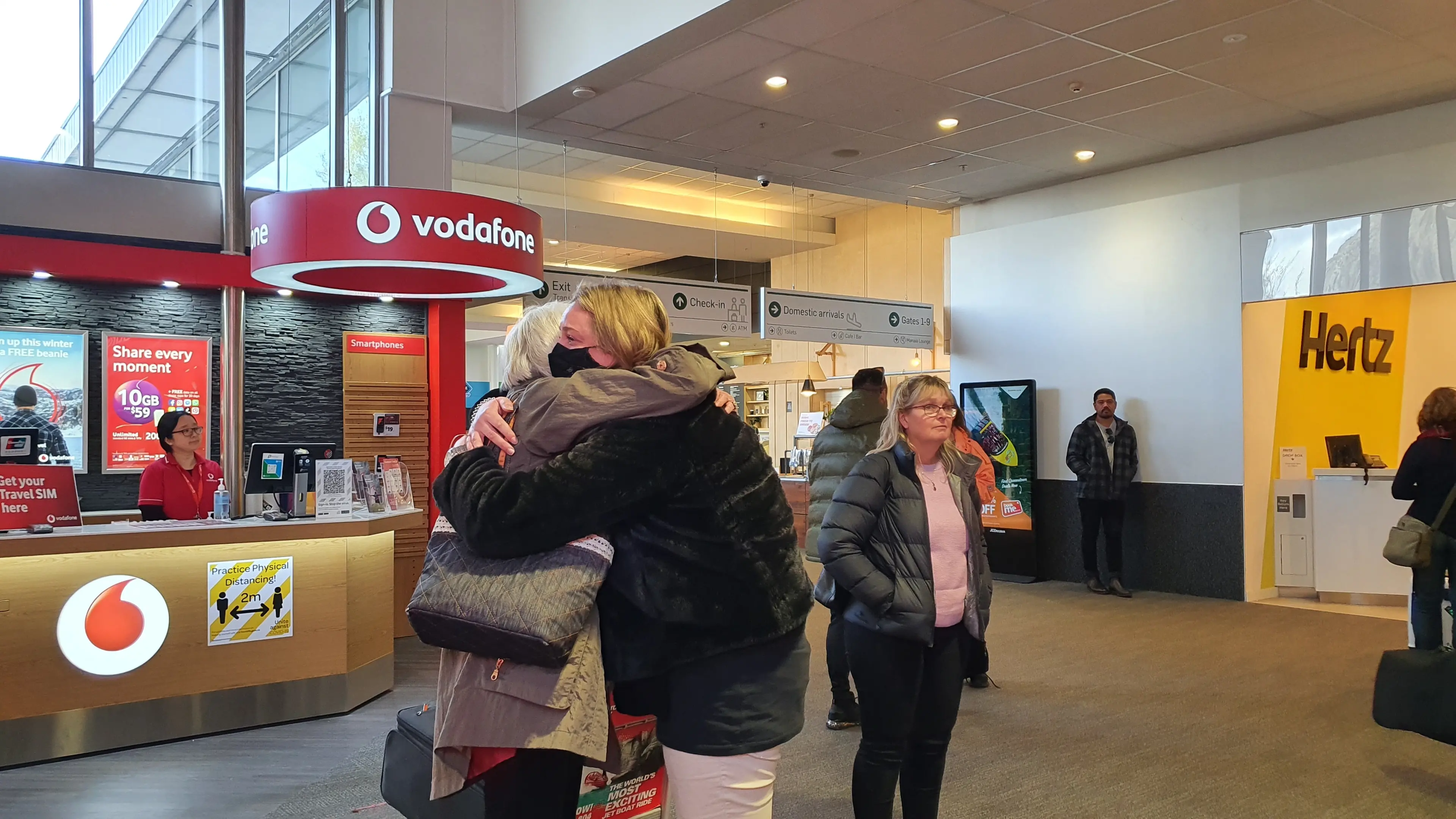 Loved-ones embrace as travel bubble resumes